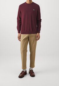 Lacoste Stickad tröja - bordeaux