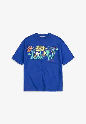Blue short-sleeve t-shirt with colorful abstract floral design across chest and small "BOBO CHOSES" text on the right side.