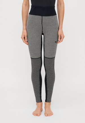Zwart-witte gestreepte leggings met een hoge taille, voorzien van een textuur gebreid patroon op de onderbenen en effen zwarte zijpanelen.