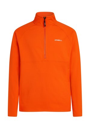 Oranssi fleecetakki, jossa on korkea kaulus ja puolivetoketjullinen malli. Sisältää raglan-hihat ja pienen valkoisen logon rinnassa.