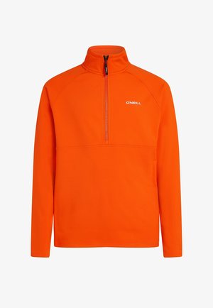 Oranger Fleece-Pullover mit hohem Kragen und halber Reißverschluss-Design. Mit Raglanärmeln und einem kleinen weißen Logo auf der Brust.