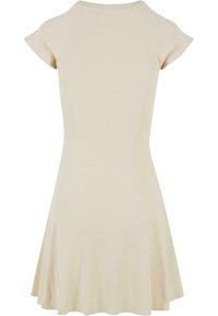 Beige short-sleeve dress made of ribbed fabric, featuring a rounded neckline and a flared skirt ending above the knee.