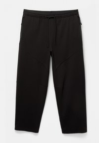 Schwarze Sporthosen mit einem taillierten Design, elastischem Bund, Kordelzug und zwei seitlichen Reißverschlusstaschen. Hergestellt aus einem glatten, dehnbaren Material.