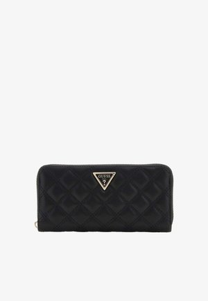Portefeuille noir matelassé avec fermeture éclair intégrale et logo Guess triangulaire doré centré sur le devant.
