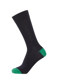 Black sock with a ribbed cuff, featuring green accents on the toe and heel. Made from a smooth, stretchy material.