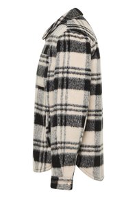 Plaid flannel shirt jacket in beige, black, and gray. Features a collared neckline, button closure, and side pocket. Soft texture.