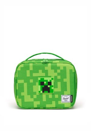Grøn pixel-lignende madkasse med et Minecraft Creeper-ansigt i midten og et Herschel Supply-mærke i nederste højre hjørne.