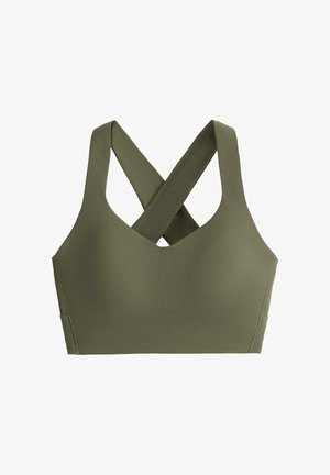 Olijfgroene sportbeha met brede banden die elkaar kruisen aan de achterkant en een glad, naadloos ontwerp.