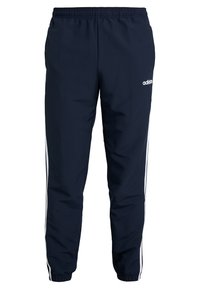 Marineblaue Sporthose aus leichtem Material mit lockerer Passform, mit weißen Seitenstreifen und elastischem Bund.