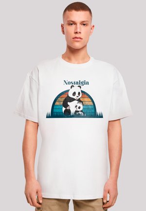 White cotton t-shirt featuring a graphic of a parent and baby panda against a colorful arch background with the text "Nostalgia."