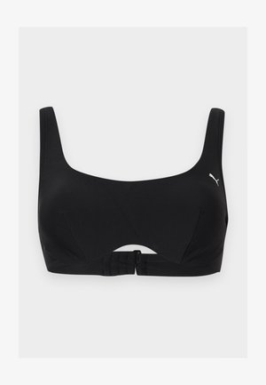 Fekete sports melltartó széles pántokkal, kerek nyakkivágással, elülső kapoccsal és kis fehér Puma logóval a bal oldalon.