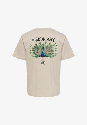 Beige T-shirt with a colorful peacock graphic spreading its feathers, "VISIONARY" text above and "only and sons" below.