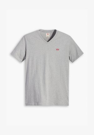 Harmaa puuvillainen v-pääntie t-paita, jossa on lyhyet hihat ja pieni punainen Levi's-logo rinnassa. Pehmeä tekstuuri ja klassinen fit.