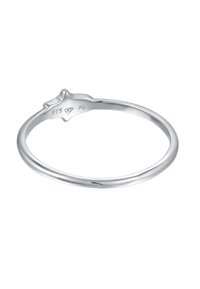 Bague en argent avec un anneau lisse et arrondi, ornée d'un accent en forme d'étoile. Marquée "925" pour l'argent sterling et "A0" pour l'authenticité.