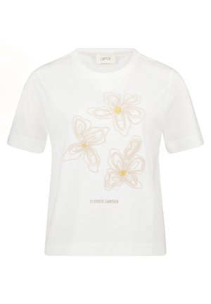 T-shirt blanc à manches courtes avec trois fleurs beiges brodées et le texte "FLOWER GARDEN" centré en dessous du motif.