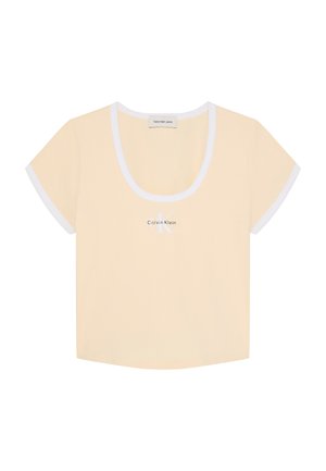 Crop top beige à manches courtes pour femme avec bord blanc aux manches et à l'encolure, avec logo Calvin Klein centré à l'avant.