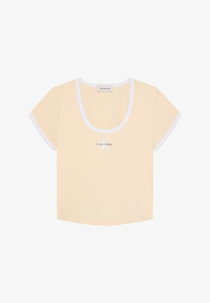 Crop top beige à manches courtes pour femme avec bord blanc aux manches et à l'encolure, avec logo Calvin Klein centré à l'avant.