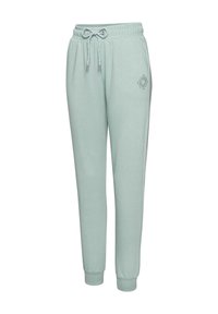 Helle türkisfarbene Jogginghose aus weichem Stoff, mit einem elastischen Bund und Kordelzug sowie einem kleinen grafischen Detail am Bein.