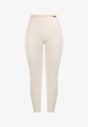 Beige leggings met een hoge taille, gemaakt van een gladde, rekbare stof. Beschikt over een naadloos ontwerp zonder zichtbare stiksels of patronen.