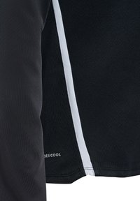 Black athletic shirt with a textured fabric, featuring a white side stripe. Logo "BEEcool" is printed near the hem.