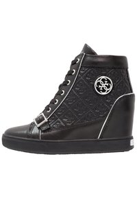 Black high-top sneaker with a textured upper, featuring a silver logo accent, lace closure, and contrasting white trim on the wedge sole.