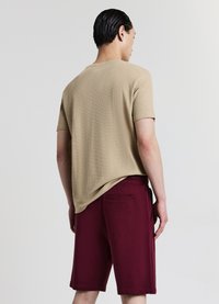 Calliope GINNICO - Pantalon de survêtement - bordeaux