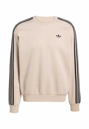 Beige sweatshirt with black three-stripe accents on sleeves, ribbed cuffs and hem, round neckline, and small black logo on chest.