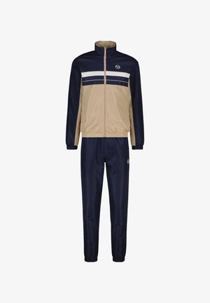 Marineblauer und beiges Trainingsanzug mit einer Reißverschlussjacke, die weiße horizontale Streifen aufweist, sowie passenden Hosen. Hergestellt aus glattem, leichtem Material.