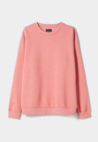 Mjuk rosa långärmad crewneck sweatshirt med ribbade fållar och nederkant, avslappnad passform, visad på en enkel ljus bakgrund.