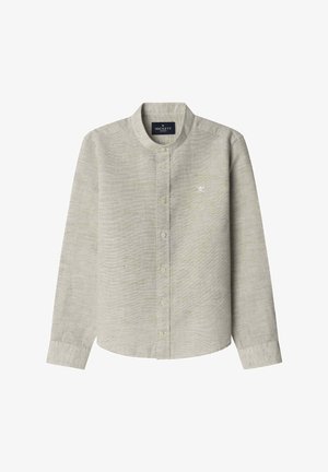Lichtgrijze longsleeve shirt met een ronde kraag, een knoopsluiting aan de voorkant en een subtiele textuur. Bevat een klein geborduurd logo op de borst.