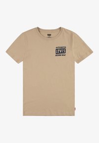 Camiseta de algodón beige con cuello redondo, mangas cortas y un diseño gráfico en color azul marino en la parte izquierda del pecho.