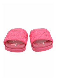Pink quilted slide sandals with a padded upper and a flat, rubber sole. Features embossed branding on the front.