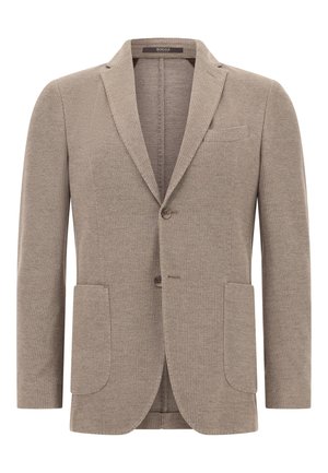 Blazer marrón texturizado con dos bolsillos frontales y un bolsillo en el pecho. Con solapas muesca y cierre de dos botones. Ajuste entallado.