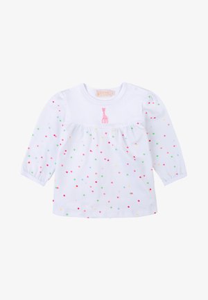 Maglietta bianca a maniche lunghe con scollo rotondo, vita arricciata e pois multicolori. Giraffa rosa ricamata vicino al colletto.