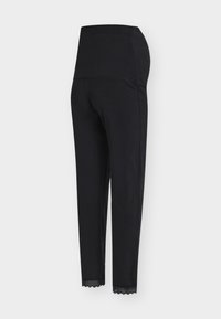 Τα μαύρα κολάν διαθέτουν ψηλή μέση και δαντελωτή διακόσμηση στο τελείωμα. Κατασκευασμένα από απαλό υλικό, έχουν εφαρμοστή γραμμή με ελαστικότητα για άνεση.