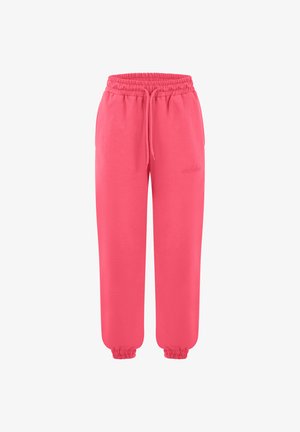 Roze joggingbroek met elastische tailleband en boorden, vooraan een trekkoord en zijzakken, afgebeeld tegen een witte achtergrond.