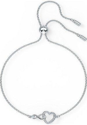 Ασημένια ρυθμιζόμενη βραχιόλα με σύμβολο του άπειρου που συνδέεται με μια καρδιά, διακοσμημένη με μικρές διαφανείς πολύτιμες πέτρες στο σχήμα της καρδιάς.