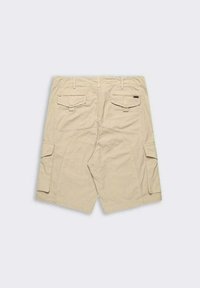 Pantaloni cargo beige con doppie tasche posteriori, tasche laterali cargo e un tessuto robusto e testurizzato. Progettati per praticità e comfort.