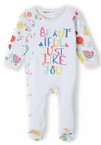 White baby jumpsuit with colorful fruit and flower patterns on sleeves; features text "BEAUTIFUL JUST LIKE YOU" in vibrant letters.