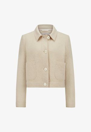 Beige kurz geschnittene Jacke aus strukturiertem Stoff, mit einem Kragen, einer vorderen Knopfleiste und zwei aufgesetzten Taschen mit abgerundeten Kanten.