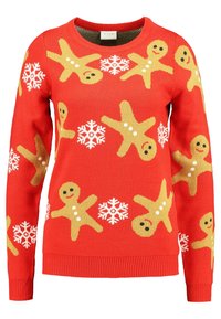 Pull en maille rouge avec des bonshommes en pain d'épice et des flocons de neige en jaune et blanc. Col rond, poignets et ourlet côtelés.