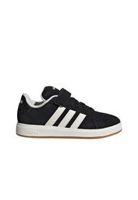 Crne suede tenisice s bijelim kožnim prugama, gumeni potplat i čičak traka. Imaju podstavljeni ovratnik i klasični adidas logotip.