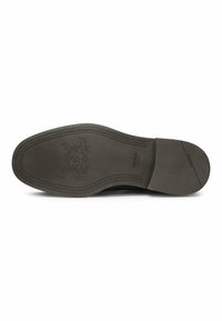 Sole di scarpa in pelle nera con superficie liscia, cuciture decorative, logo impresso e punta arrotondata. Materiale in gomma piatta per la presa.