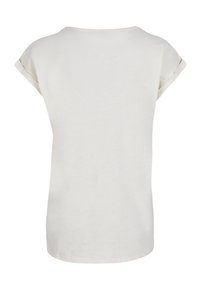 White short-sleeve t-shirt made from soft cotton, featuring a relaxed fit, rounded neckline, and rolled cuffs. No visible patterns or accents.