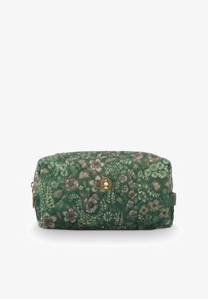 Quilted toiletry bag in green with floral pattern, featuring a gold-tone accent and zipper closure. Rectangular shape with soft texture.