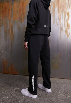 Pantalones deportivos - black
