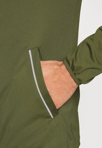 Nike Performance M NK DRY ACD21 TRK SUIT K - Fato de treino - rough green/white