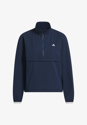 Suéter de manga larga azul marino con media cremallera, de tela texturizada y con una costura horizontal. Presenta el logotipo blanco de Adidas en el pecho.