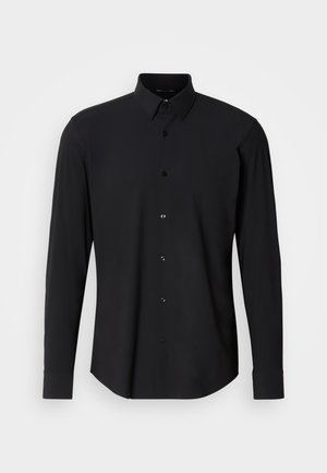 Black long-sleeve shirt featuring a collar, button-up front, and rounded hem. Made from smooth fabric with subtle texture. Black buttons included.