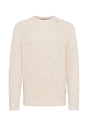 Kremfarget strikket genser med ribbestruktur, lange ermer og rund hals. Har subtile prikker av mørkere nyanser.